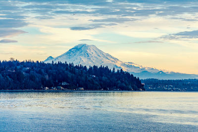 A view of mount rainier from burien, washington at sunset.