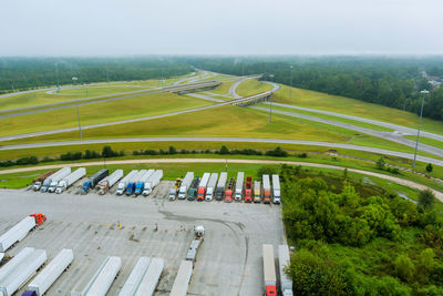 High angle view of vehicles on road against sky