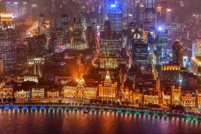 Illuminated city buildings at night