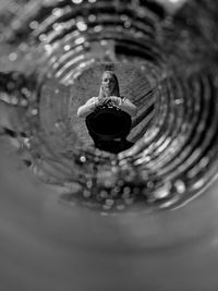 High angle view of woman sitting in water