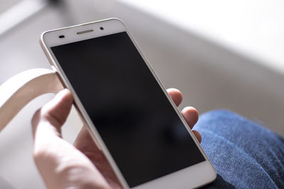 Close-up of hand using mobile phone