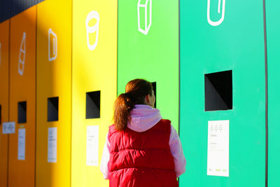 Russia, saint petersburg september 03, sorting waste. a woman throws out garbage