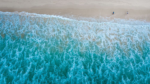 High angle view of people on swimming pool