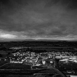 Cityscape against cloudy sky