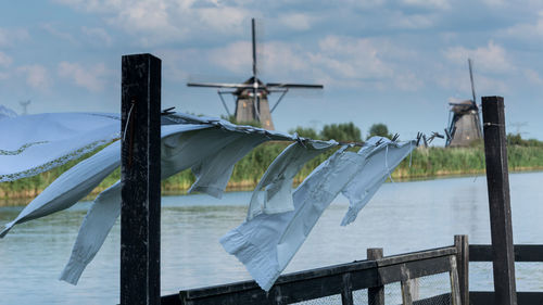 Close-up of wind turbines against sky
