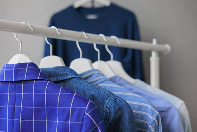 Close-up of clothes hanging on rack