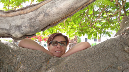 Portrait of smiling boy against plants
