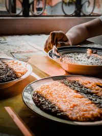 High angle view of person preparing food on table