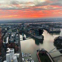 High angle view of city buildings during sunset