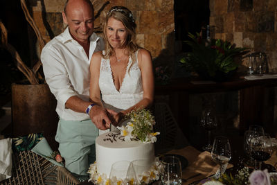 Man and woman standing by food