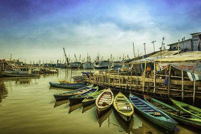 Boats moored at harbor