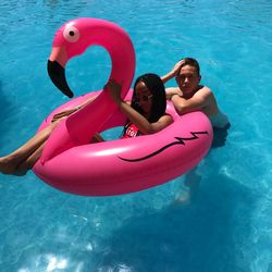 High angle view of siblings in swimming pool