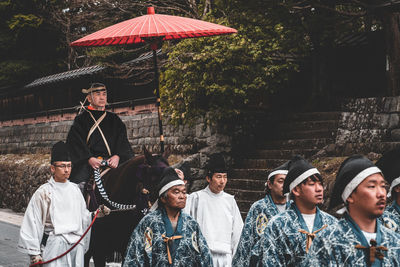 Group of people standing in a row