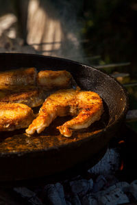 Close-up of meat on barbecue grill