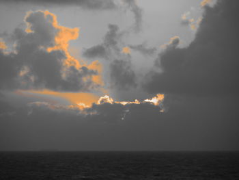 Scenic view of sea against sky at sunset