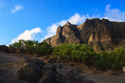 Rock formations on land against sky