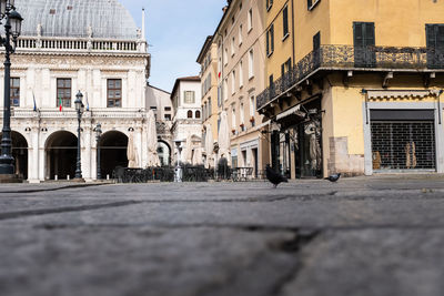 Surface level of street amidst buildings in city