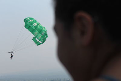 Man parasailing against sky