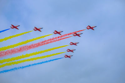 Low angle view of airshow against clear sky