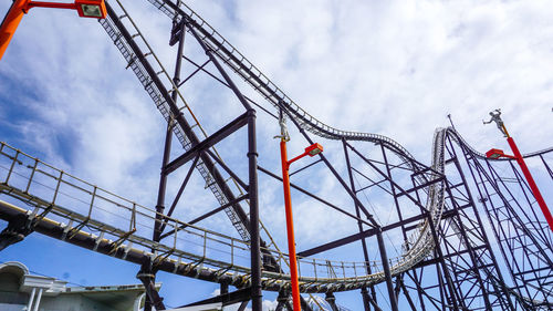 Low angle view of crane against sky