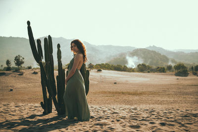 Woman standing in a desert