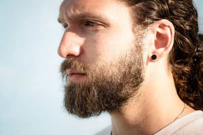 Close-up of young man looking away