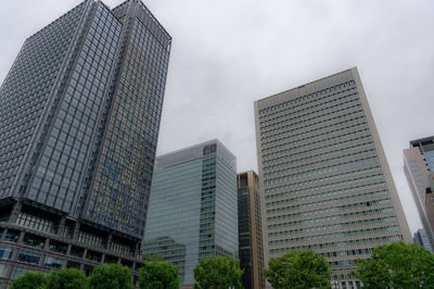 Low angle view of modern buildings against sky