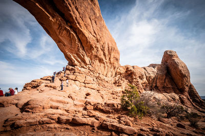 Low angle view of rock formation against sky