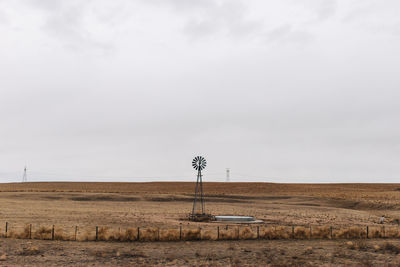 Water pump windmill on field