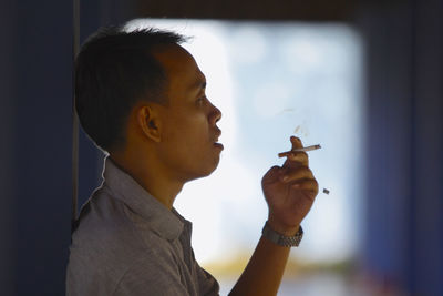 Close-up of man holding camera