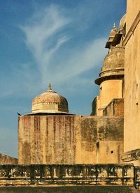 Low angle view of cathedral against cloudy sky