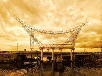 Cranes against sky