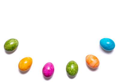 Close-up of fruits over white background