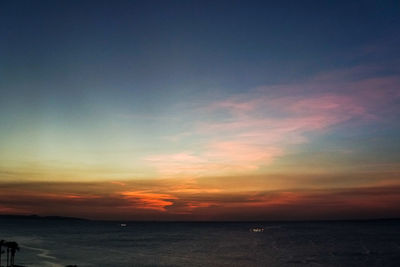 Scenic view of sea against romantic sky at sunset