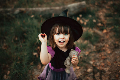 Portrait of cute girl with arms outstretched