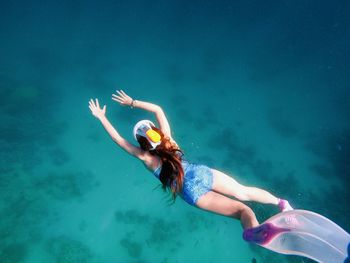 Woman swimming in sea