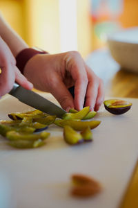 Cropped hand of person holding bell pepper