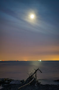 Scenic view of sea against sky at sunset