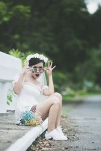 Portrait of woman sitting outdoors