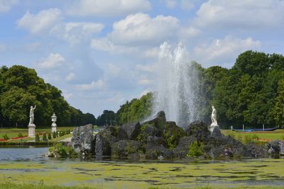 Fountain splashing over rocks at park