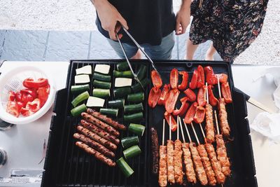 High angle view of man preparing food on plate