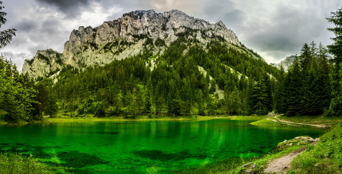 Scenic view of landscape against cloudy sky