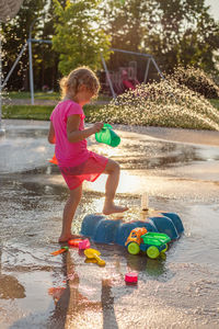 Portrait of boy playing with water