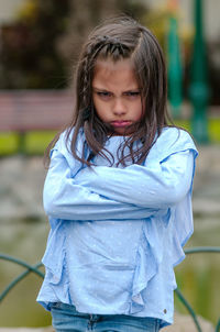 Portrait of cute girl standing outdoors