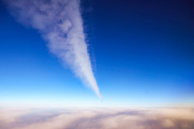 Low angle view of vapor trail against blue sky