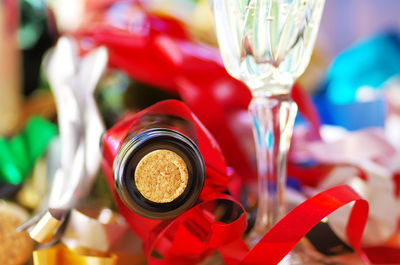 Close-up of wine bottle with cork with ribbons