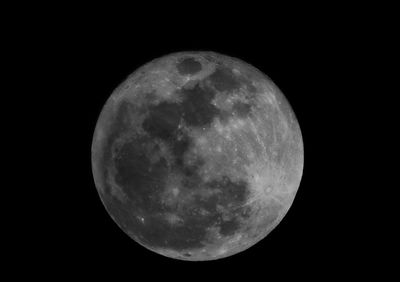 Low angle view of moon against clear sky at night