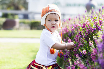 Cute boy looking at camera on field