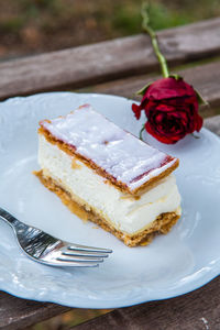 Close-up of mille-feuille in plate on table outdoors