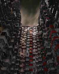 Low angle view of illuminated buildings against sky at night